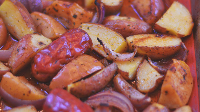 Cajun Taters & Sausage - an easy sheet pan supper from Cosmopolitan Cornbread. Perfect for your Football Festivities!