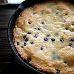This Lemon Blueberry Cake baked in a cast iron skillet is a delightful fusion of zesty citrus and sweet, juicy blueberries, offering a rustic yet tender dessert or brunch treat.