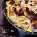 This delicious Bacon & Egg Strata is the comfort food of breakfast. Enjoy this dish with your family today. Get the recipe from Cosmopolitan Cornbread.