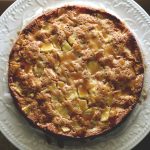 German Apple Cake with rum-soaked raisins and brown sugar glaze drizzle. Get this amazing recipe from Cosmopolitan Cornbread