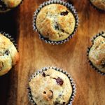 Coffee Shop Style Chocolate Chip Muffins | Fluffy and moist muffins with a sprinkling of crunchy sugar. Get the recipe from Cosmopolitan Cornbread