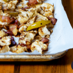 Scrumptious Roasted Cauliflower sprinkled with bacon and apple slices make for a side dish that will make you forget all about the entree! You'll love this easy, low carb and paleo-friendly dish.