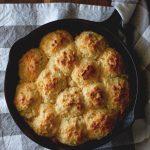 These Skillet Cheddar Biscuits are golden biscuits with a perfect, crunchy bottom and moist, cheesy inside. These will be your favorite biscuits ever.