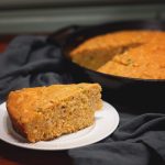 Cheddar Jalapeno Cornbread from Cosmopolitan Cornbread - Incredibly hearty cornbread packed with bits of jalapeno, onion and cheddar cheese.