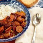 Red beans and rice is a traditional, Louisiana Creole dish with loads of spiced flavor. This short cut version lets you enjoy this without the need of starting with dry beans.