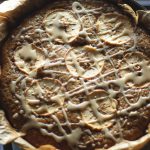 Skillet Apple Cake with Lemon Drizzle - This old-fashioned style apple cake has grated apple inside, sliced apples on top, is baked in a cast iron skillet and then finished off with a drizzle of lemon glaze.