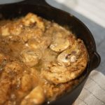 Smothered Chicken is juicy chicken breasts are lightly browned and simmered in a creamy, rich mushroom gravy bursting with earthy flavors of Cajun seasoning, sautéed onions and tender mushrooms.
