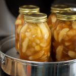 Learn how to make and can homemade apple pie filling. This recipe does not use clear jel and can be used for pies, cobblers and all sorts of recipes.