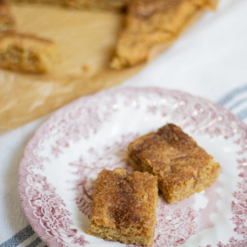 These buttery Snickerdoodle Bars offer a soft, melt-in-your-mouth texture, dusted with a sparkling cinnamon-sugar crust, delivering a nostalgic, home-baked comfort in every bite.