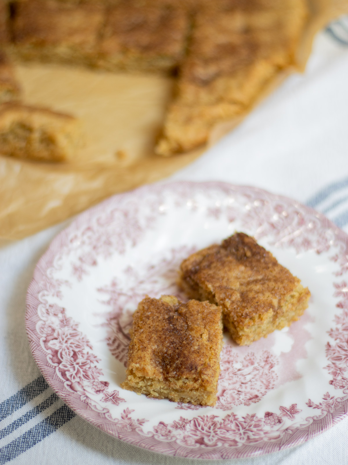 These buttery Snickerdoodle Bars offer a soft, melt-in-your-mouth texture, dusted with a sparkling cinnamon-sugar crust, delivering a nostalgic, home-baked comfort in every bite.