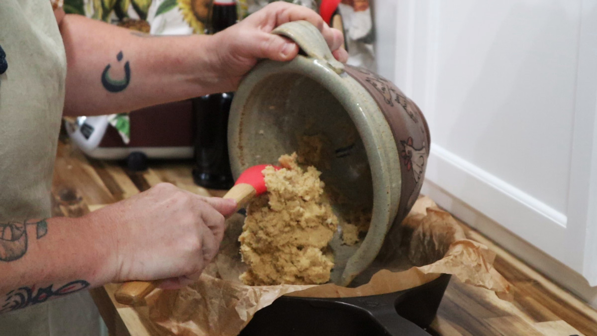 spreading snickerdoodle dough into a skillet