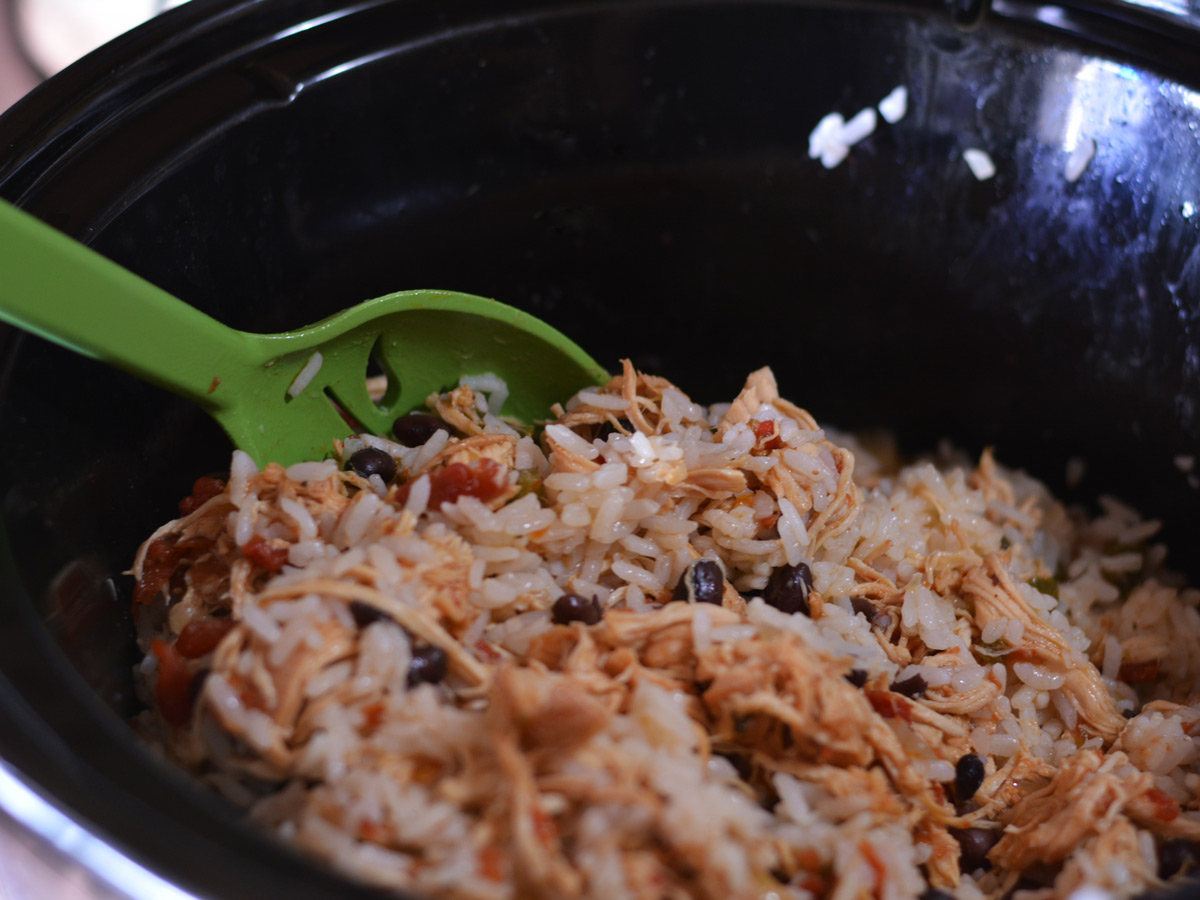 stirring together the ingredients in a slow cooker