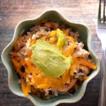 This easy slow cooker recipe combines tender chicken with fluffy rice, black beans, smoky ancho chili and other seasonings, and vibrant diced tomatoes for a comforting, flavorful meal. Perfect for a fuss-free, hearty dinner.