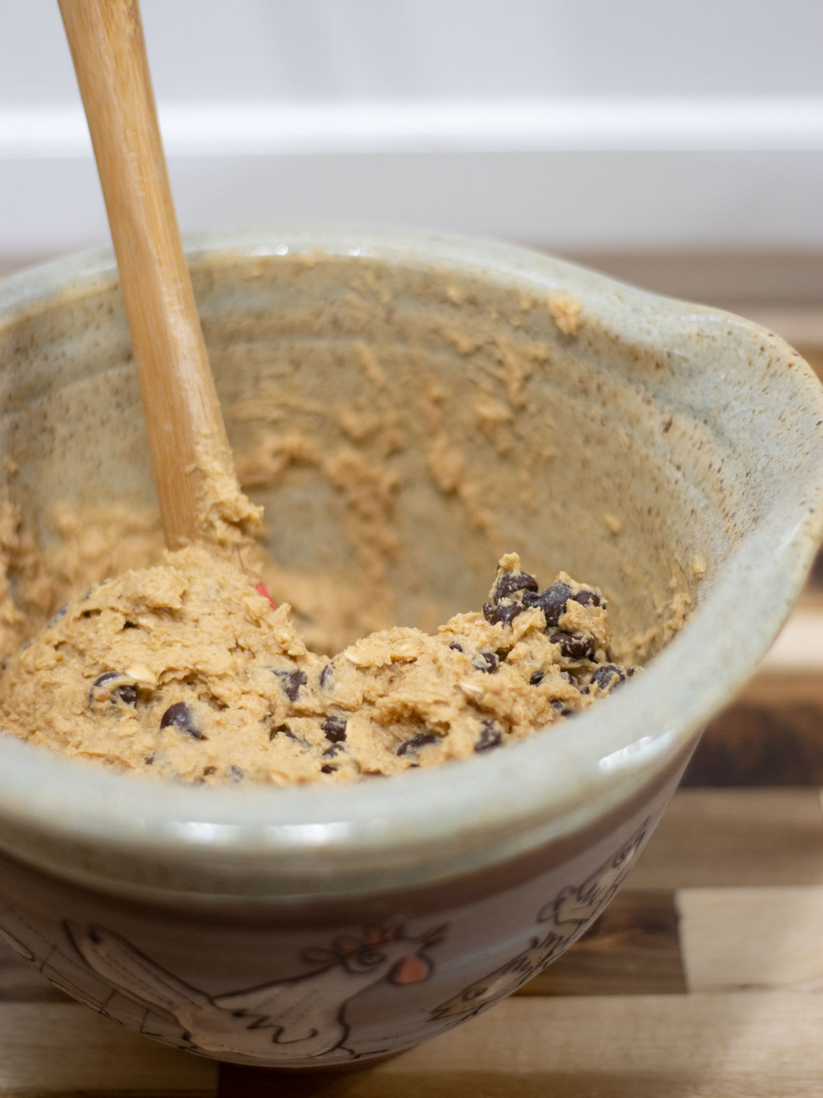 triple cookie bar ingredients in a pottery mixing bowl