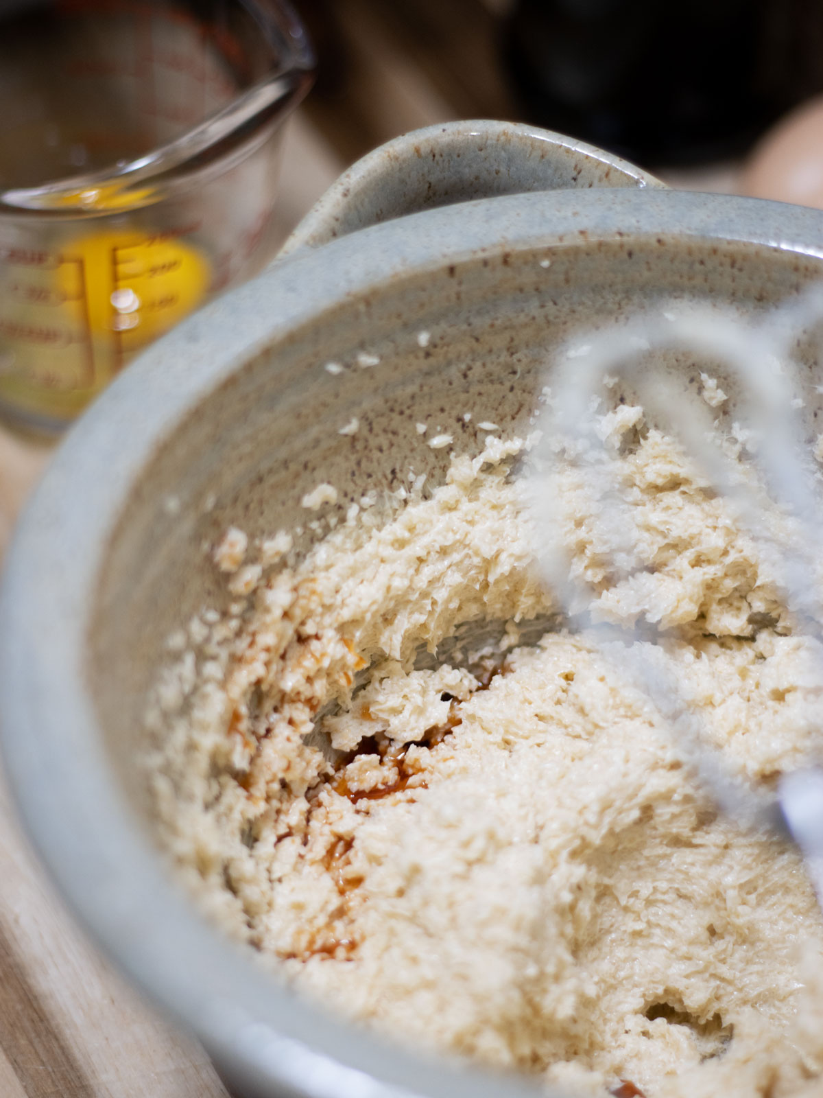 wet ingredients for buttermilk pound cake in a pottery bowl