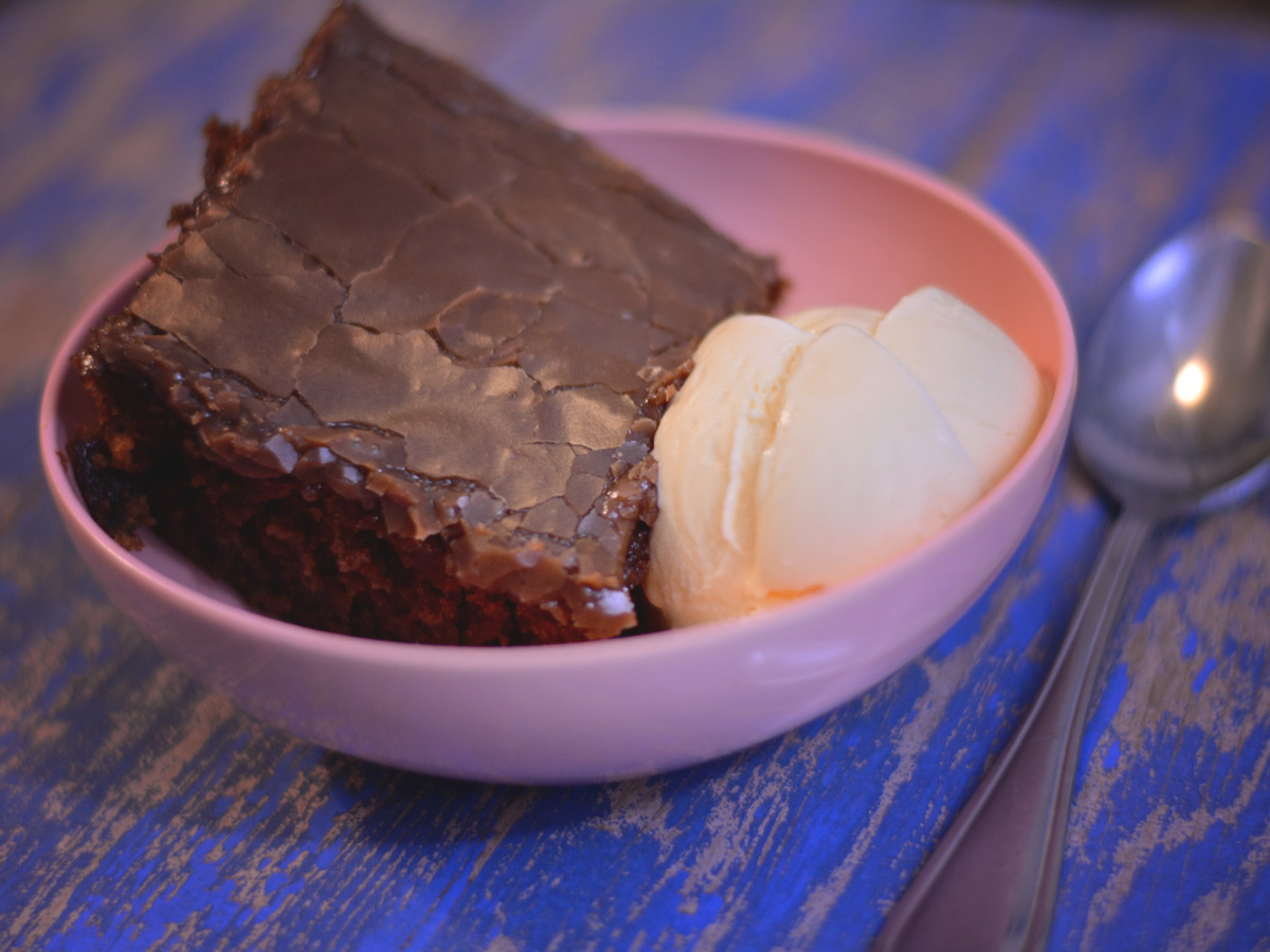 This Cracker Barrel Double Fudge Cola Cake copycat recipe recreates the restaurant's southern classic dessert at home. It has a rich, moist chocolate cake infused with a subtle cola flavor, topped with a decadent fudge frosting.