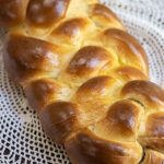 Traditional braided Challah bread, lightly sweetened with honey. Perfectly plush and golden-brown after baking, its tender crumb makes it ideal for Shabbat dinners, holidays, or simply slathering with butter.