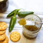 This homemade jalapeño jelly is the perfect balance of heat and sweetness — incredible over cream cheese with crackers, or brushed on grilled chicken for a spicy glaze! Learn how to make and can it right at home — it’s easier than you think!